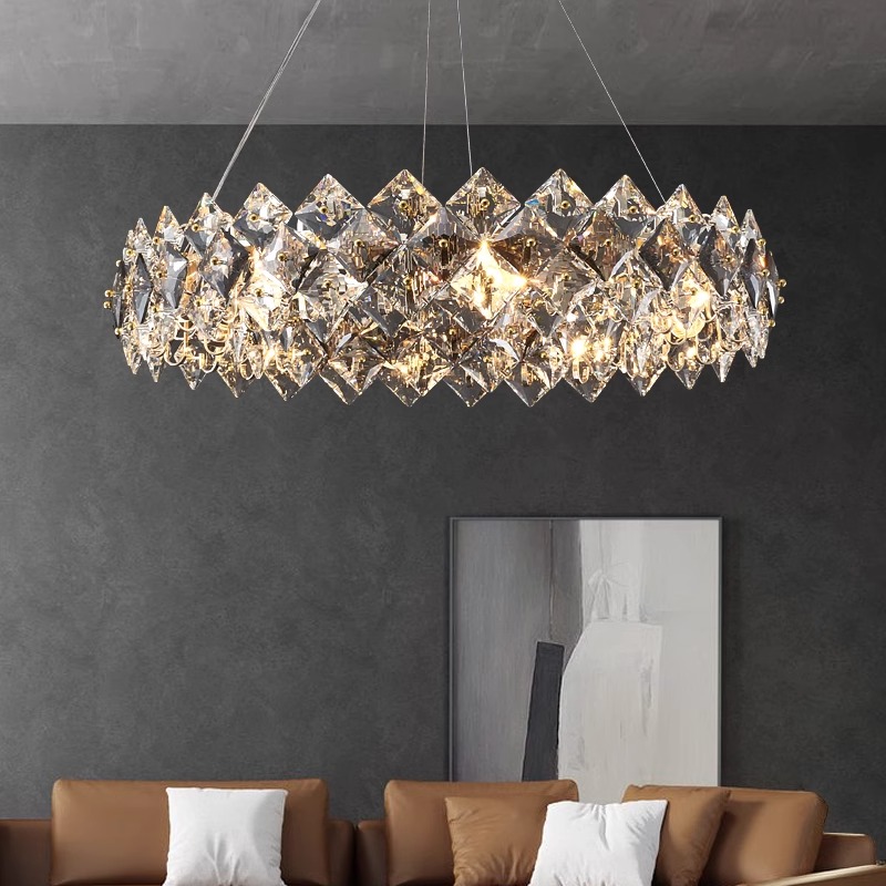 a chandelier from a ceiling in a room with a couch